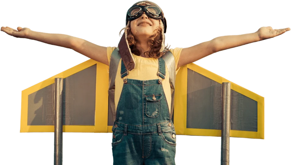 Child wearing a cardboard aeroplane and aviator goggles