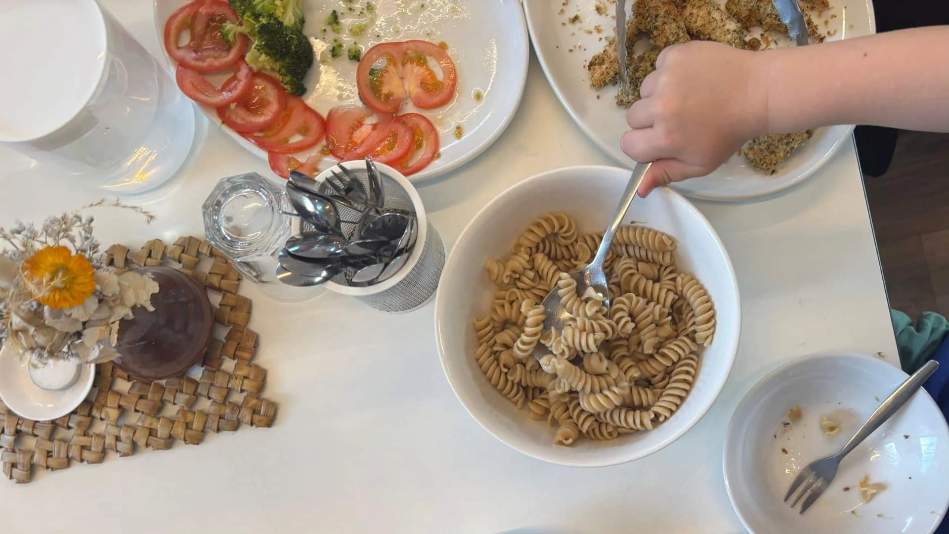 Pasta and vegetables on dining table